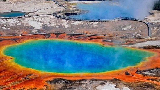 The Grand Prismatic Spring is not only the largest hot spring in Yellowstone National Park, it's also the largest in the country, and the third largest in the world. This enormous and beautiful spring is located in the Midway Geyser Basin area.